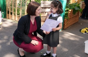 Parents doing the morning nursery drop-off at a UK childcare setting.